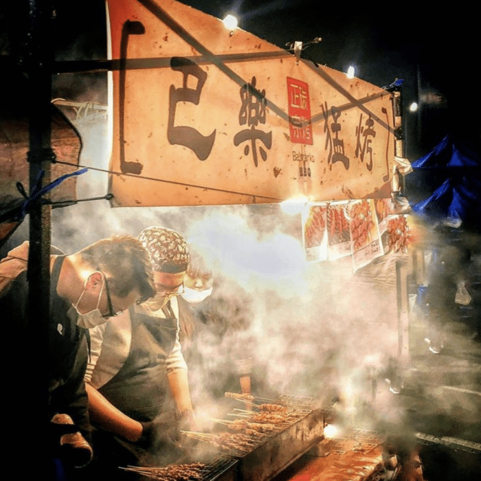 Food stall cooking at the Sunday Chartwell Night Market in Hamilton